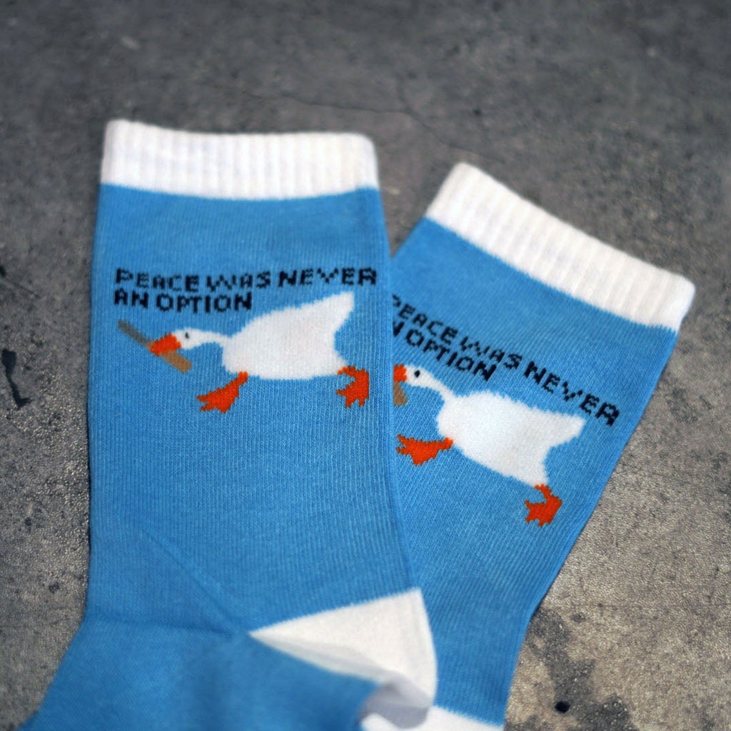Blue socks with goose holding butter knife peace was never an option