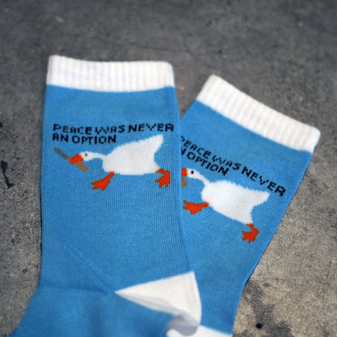 Blue socks with goose holding butter knife peace was never an option